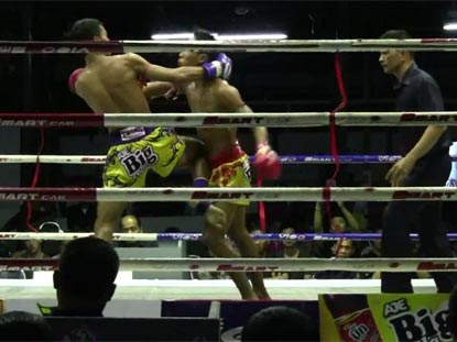 Muay Thai match at Lumpini Stadium in Bangkok city