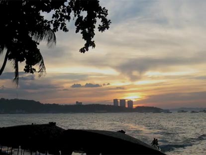 Sunset over Pattaya with jetski before dark