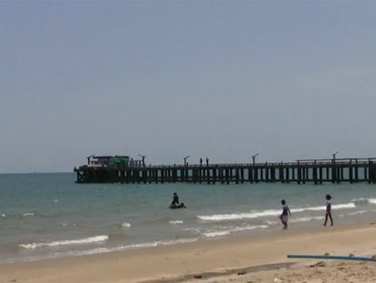 Coastal scene in Rayong with pier in background